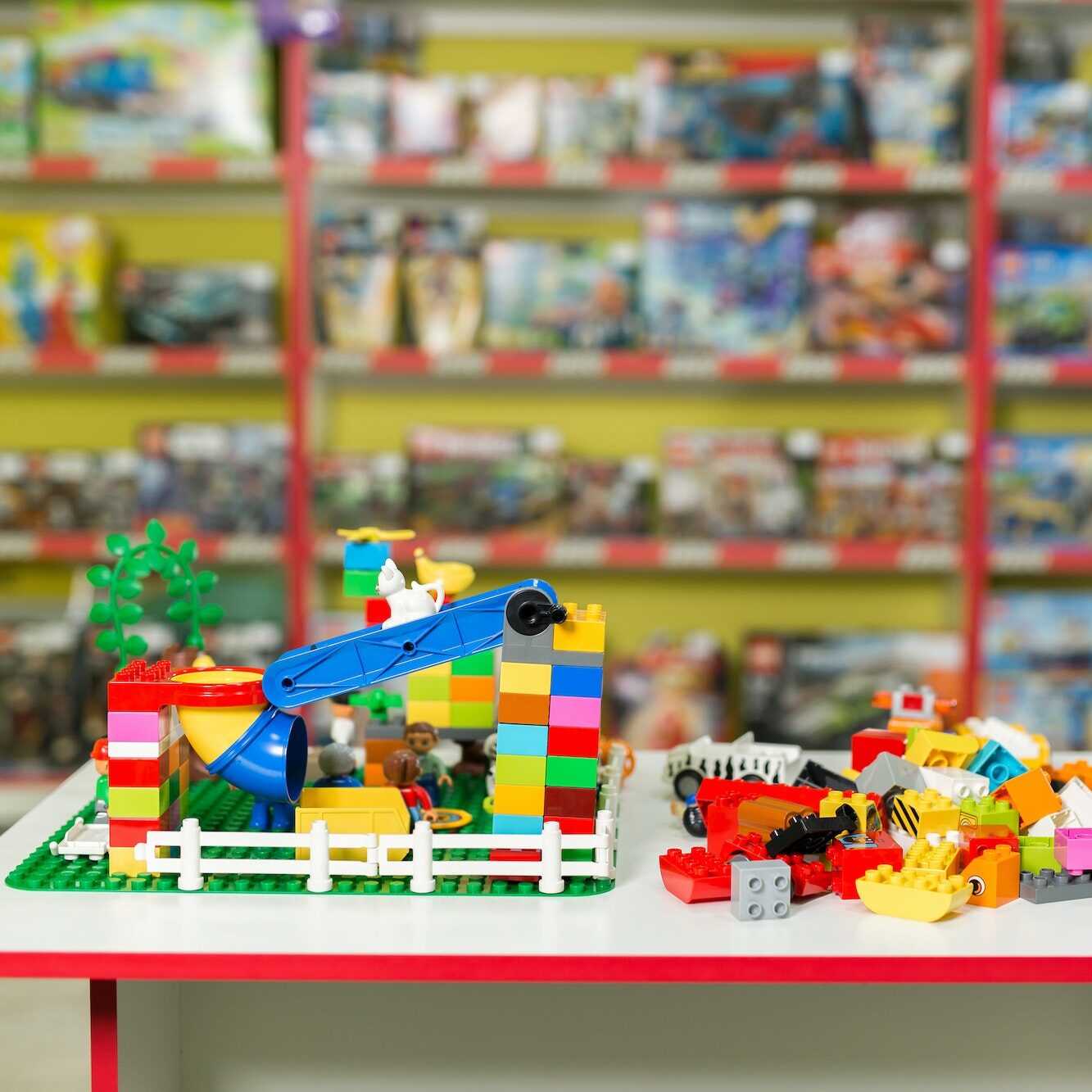 Plastic toy blocks on the white table in the store